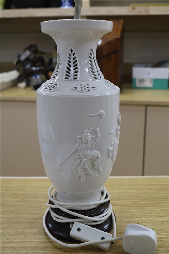 A Chinese figural whiteware lamp on wooden base